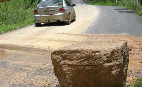 A boulder which was dislodged from the Doyles Camp Bridge and McGinley’s Road section of the Gatton-Clifton Road. A boulder which was dislodged from the Doyles Camp Bridge and McGinley’s Road section of the Gatton-Clifton Road.
